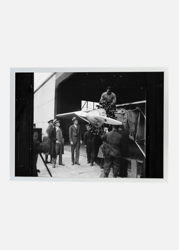 CHARLES LINDBERGH IN FRONT OF AIRPLANE