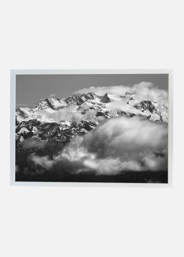 ALPINE PEAKS AMONG CLOUDS