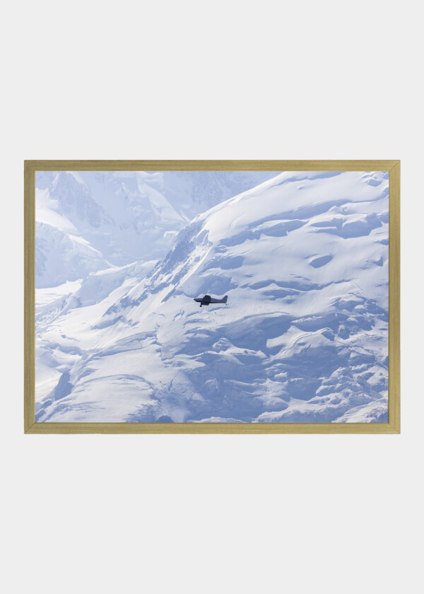 AIRPLANE OVER SNOWY MOUNTAINS