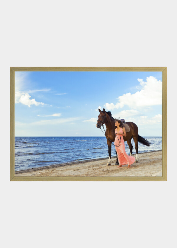 WOMAN AND HORSE ON SANDY BEACH