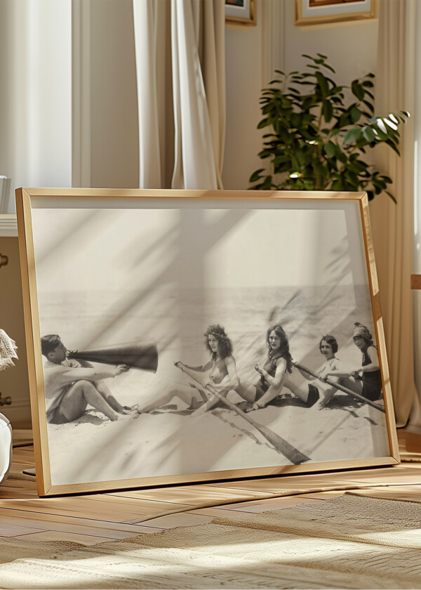 WOMEN PRACTICE ROWING ON THE BEACH