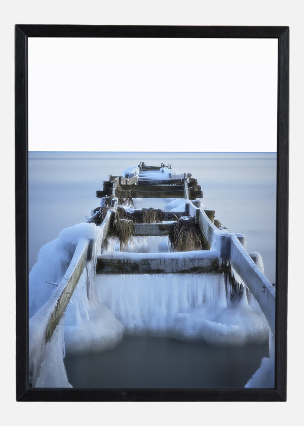 WOODEN JETTY ICED OVER DURING WINTER AT FALSTERBO, SWEDEN