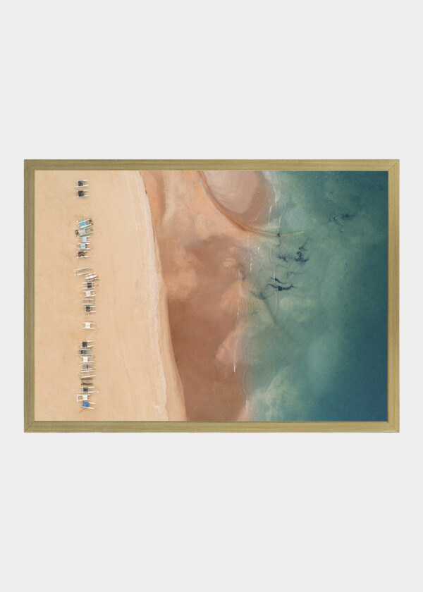 AERIAL VIEW OF CATAMARAN SAILBOATS ON A TROPICAL BEACH