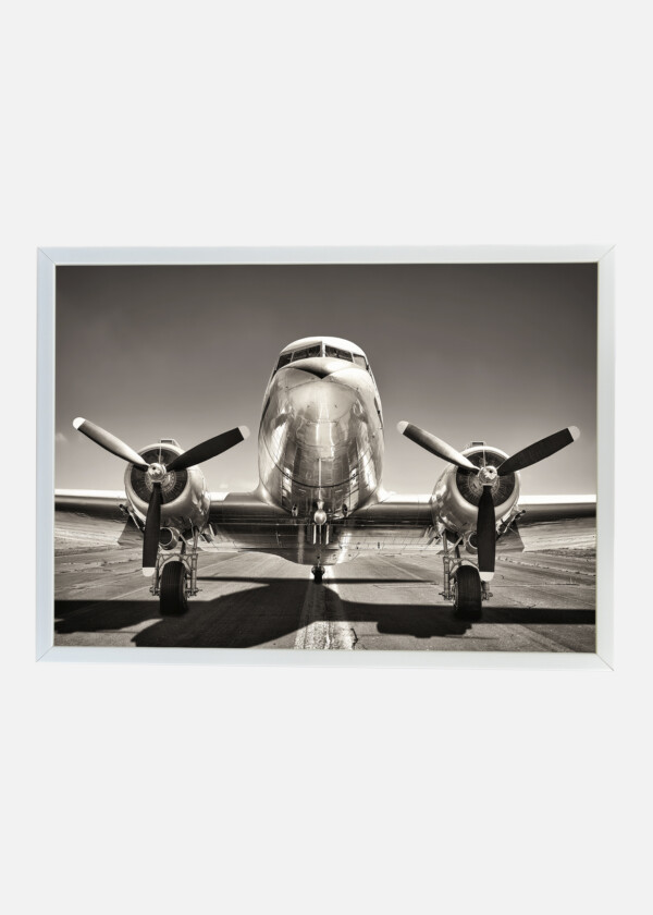 VINTAGE AIRPLANE ON A RUNWAY