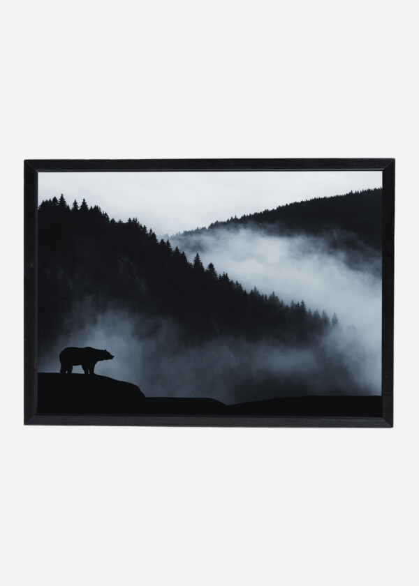 WILDERNESS LANDSCAPE WITH BEAR SILHOUETTE AND MISTY MOUNTAINS